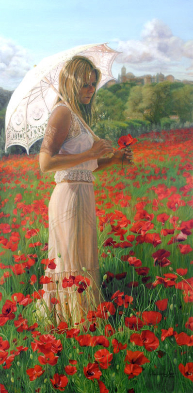 Girl with parasol in red poppy field in France